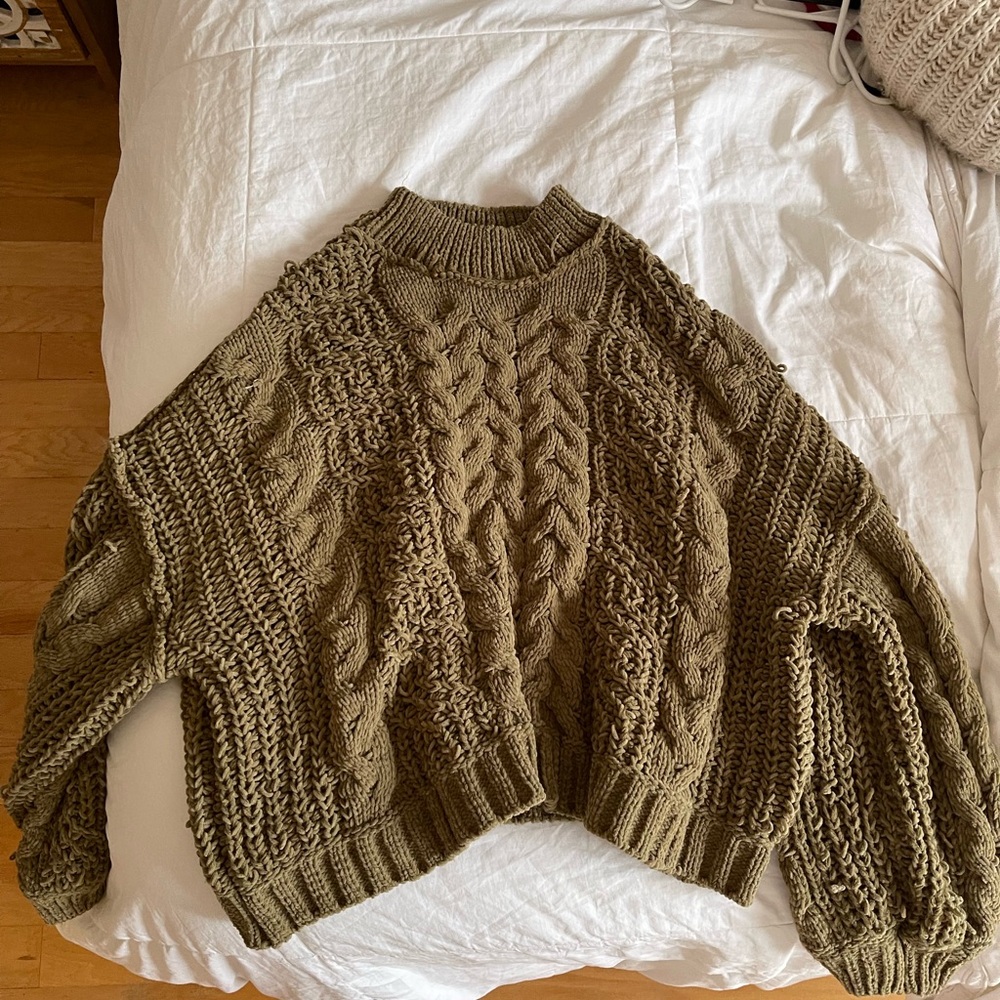 Green women’s cable knit sweater